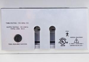 Examination table safety door